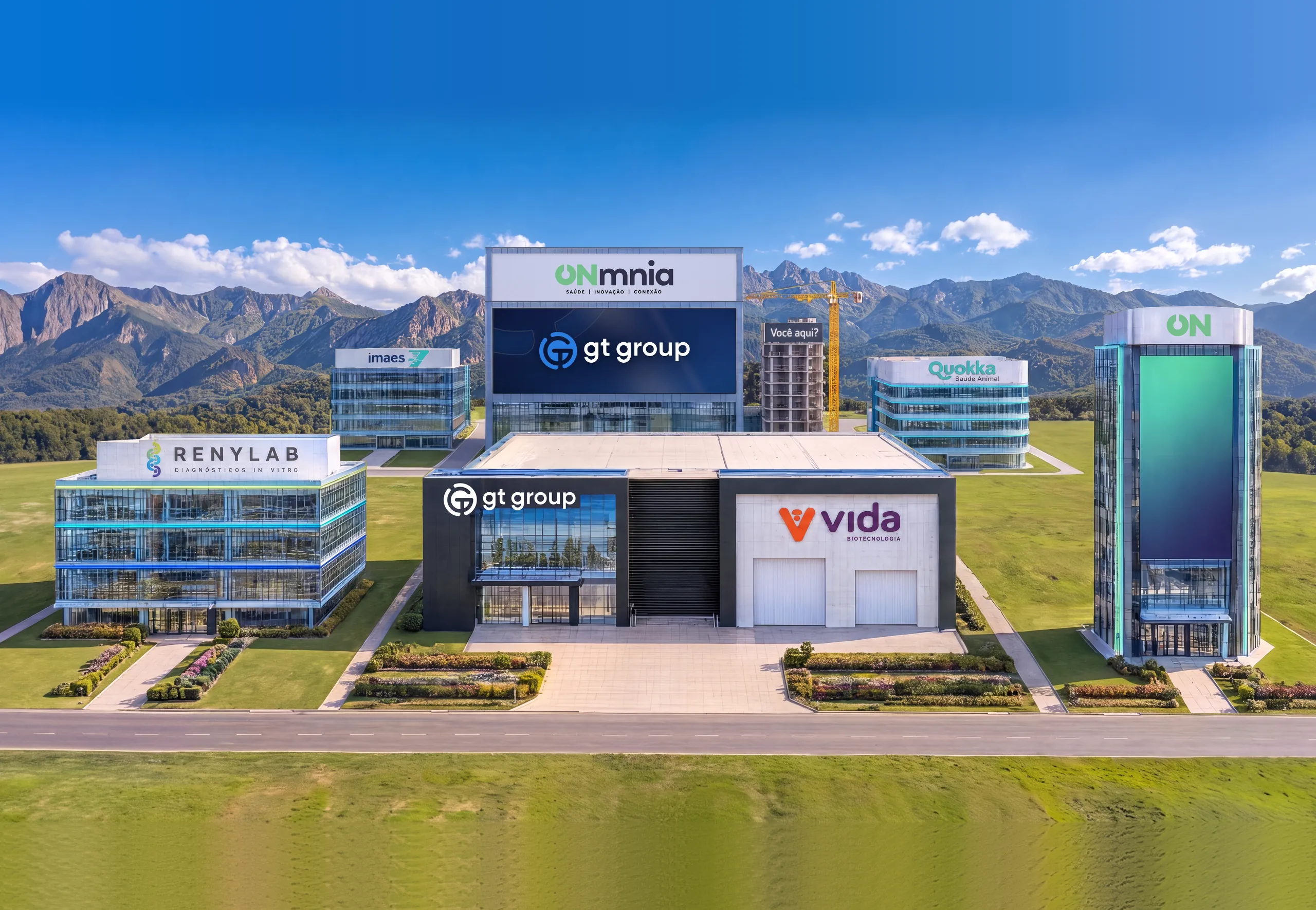 Ilustração da Cidade do Grupo: prédios com as marcas das empresas do Grupo ONmnia e um telão ao centro.
